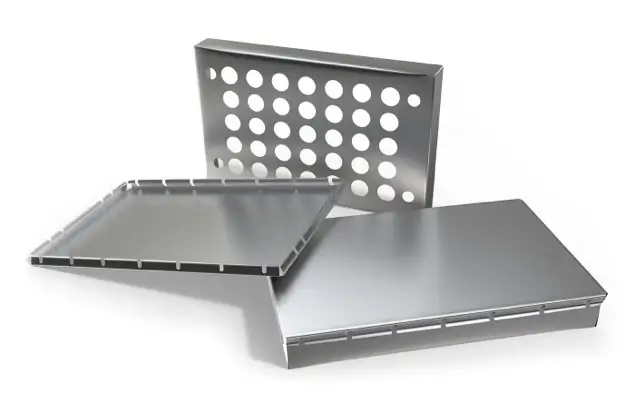 Three Stainless Steel Grilling Accessories Are Arranged On A White Background. One Plate Has Circular Perforations, Another Is Smooth With Raised Edges, And The Third Is A Slotted Grilling Pan, Also With Raised Edges.